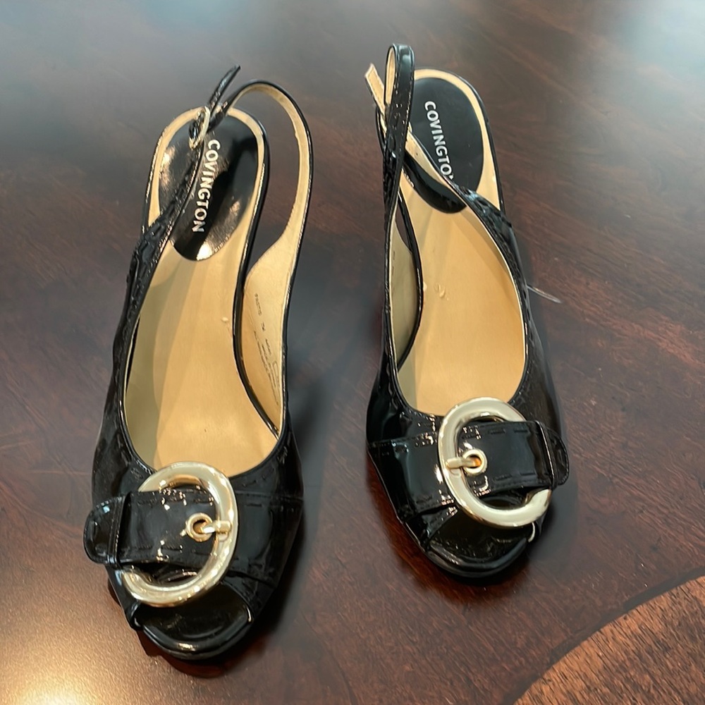 Ladies 3in. Black patent leather peep toe heel. Gold buckle at toe. Worn once